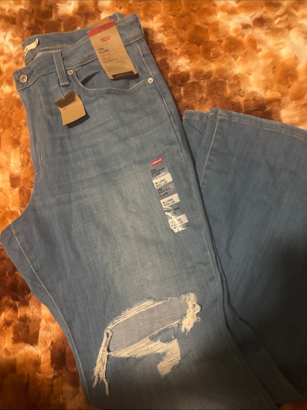 Levi's Women's Light Blue Distressed wide legged ripped jeans